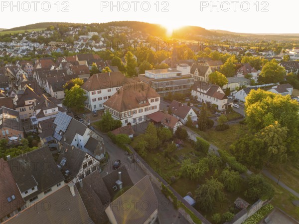 Peaceful sunset over a village with houses and lush vegetation in the landscape, 950 years Weil der Stadt ceremony, Böblingen district, Germany