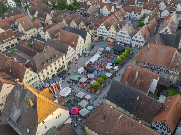 Aerial view of a town festival, surrounded by houses and trees, showing the dense town panorama, 950 years Weil der Stadt celebration, Böblingen district, Germany