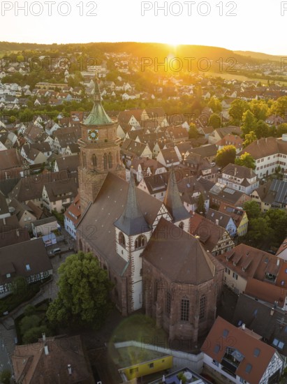 Picturesque view of a church and town at sunset with historical buildings and roof landscapes, 950 years Weil der Stadt ceremony, Böblingen district, Germany