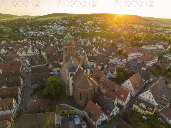 A bird's eye view of the evening cityscape with church at sunset, 950 years Weil der Stadt ceremony, Böblingen district, Germany