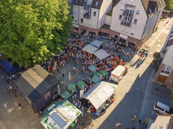 Large crowd at an open-air event, surrounded by buildings and trees, 950 years Weil der Stadt ceremony, Böblingen district, Germany
