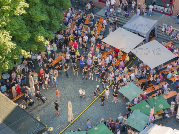 Large crowd at an outdoor event in a paved square, 950 years Weil der Stadt ceremony, Böblingen district, Germany