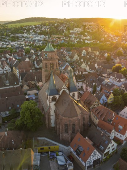 Aerial view of a church and old town centre in the evening light with surrounding landscape, 950 years Weil der Stadt ceremony, Böblingen district, Germany