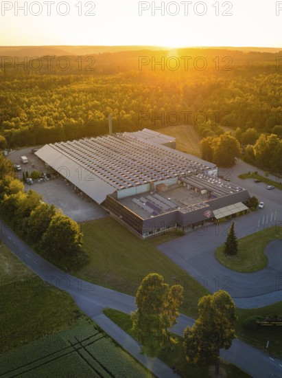 Industrial building at sunset, embedded in green nature, Sektkellerei Schnaufer, Althengstett Calw