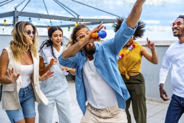 Diverse group of friends celebrating on a vibrant rooftop, singing and dancing joyfully together, embracing the carefree spirit of summer