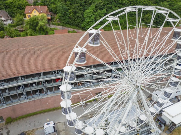 Close-up of the Ferris wheel with detailed view of the cabins and buildings in the background, Ferris wheel construction, Calw, Black Forest, Germany