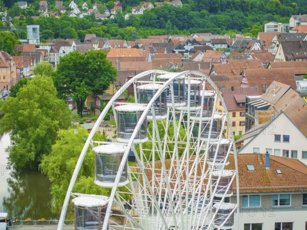 Ferris wheel in front of a town with hills and river in the background, Ferris wheel construction, Calw, Black Forest, Germany