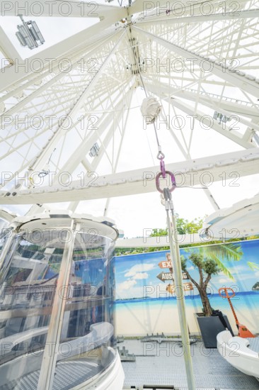 View upwards into the structure of a Ferris wheel with decorative background, Ferris wheel construction for the 950th anniversary of the town of Calw, Black Forest, Germany