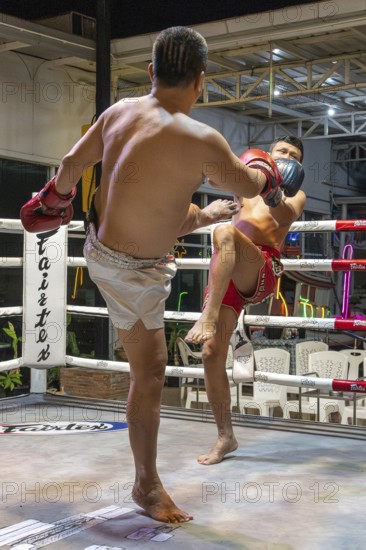 Thai boxing Muai Thai boxer in action, Pattaya, Thailand