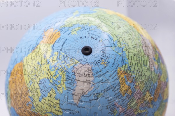 Puzzle globe. Map made from puzzle pieces. Greenland and Denmark