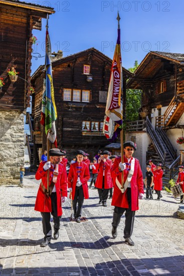 Pipers and drummers accompany the Corpus Christi procession, historic town centre, Grimentz, Val d'Anniviers, Valais Alps, Canton Valais, Switzerland