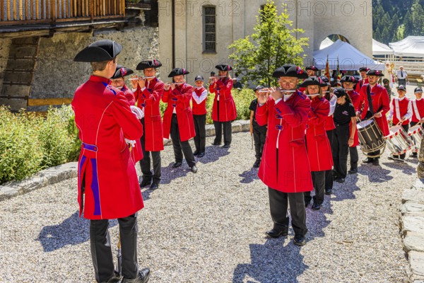 Pipers and drummers line up for the Corpus Christi procession, historic village centre, Grimentz, Val d'Anniviers, Valais Alps, Canton Valais, Switzerland