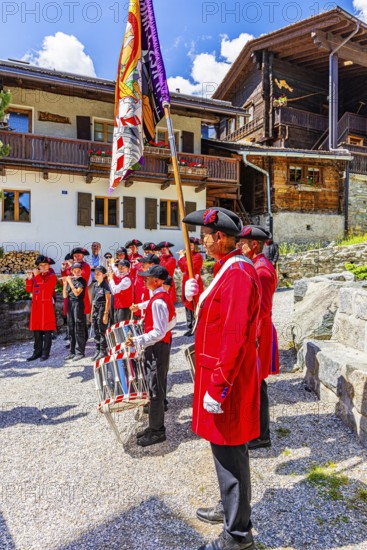Pipers and drummers play in the historic village centre, Grimentz, Val d'Anniviers, Valais Alps, Canton Valais, Switzerland
