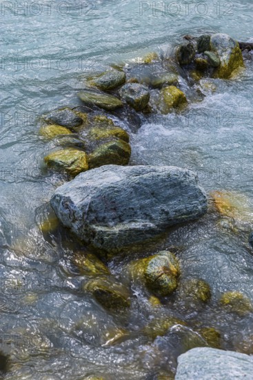 Boulders obstruct the flow in the mountain stream La Navisence, near Zinal, Val d'Anniviers, Valais Alps, Canton Valais, Switzerland