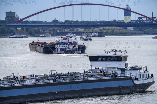 Cargo ships on the Rhine, in the background the Rhine bridge near Duisburg-Rheinhausen, Bridge of Solidarity, Duisburg, North Rhine-Westphalia, Germany