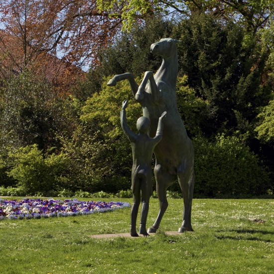 Artwork with the title Hengst Wohlklang in der Freiheitsdressur by Ulrich Conrad in the palace gardens, Celle, Lower Saxony, Germany