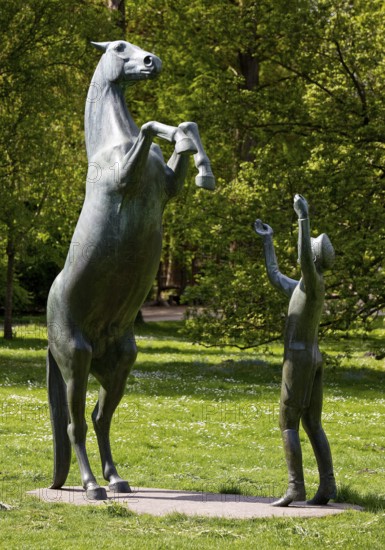 Artwork with the title Hengst Wohlklang in der Freiheitsdressur by Ulrich Conrad in the palace gardens, Celle, Lower Saxony, Germany