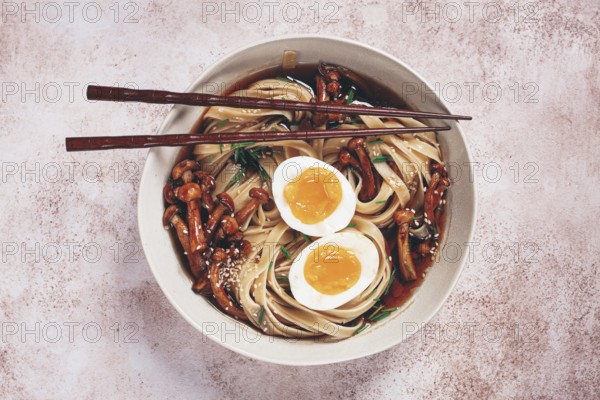 Buckwheat noodles soba with shimeji mushrooms, with boiled egg, green onion, sesame seeds, homemade, without people