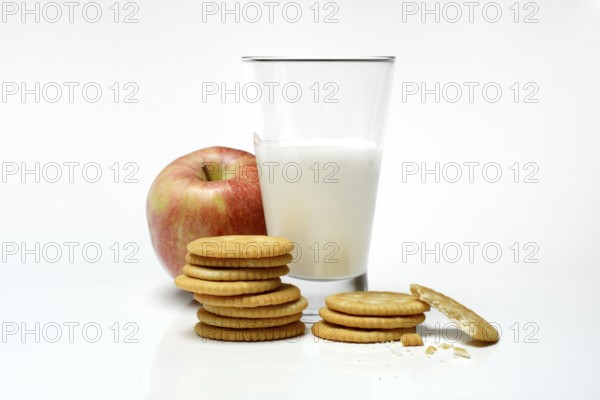 Cracker with glass of milk and apple
