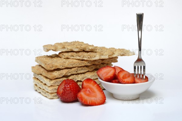 Crispbread and bowl of strawberries