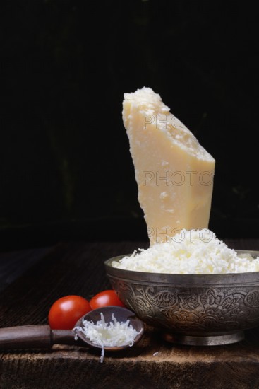Parmesan cheese, grated cheese in rind and piece of Parmesan, Italy