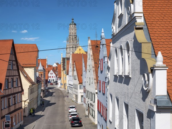 View from the medieval town wall over the houses of the historic old town to the tower of St George's Church, called Daniel, Nördlingen, Bavaria, Germany