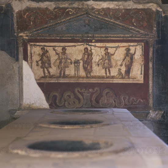 Thermopolium of the Aseline, the thermopolia were the snack parlours where the inhabitants of the city were provided with hot food and drinks, Pompeii, Italy, Mercury and Dionysus were worshipped in a beautiful lararium with Corinthian columns