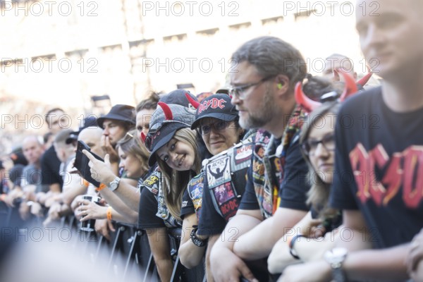 Fans in the front row in front of the concert of AC/DC live on Power Up Tour 2025 at the Olympiastadion Berlin on 30 June 2025