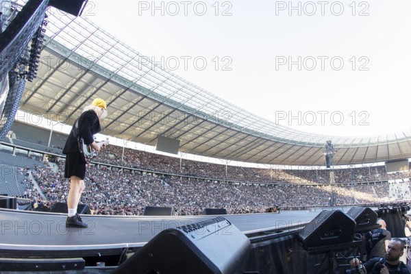 Angus Young, lead guitarist of AC/DC live on Power Up Tour 2025 at the Olympiastadion Berlin on 30 June 2025. Note: the photo was taken with a fisheye lens