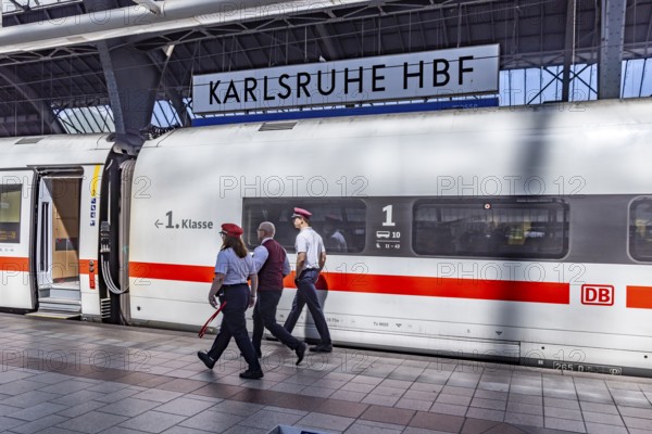 Karlsruhe main station with ICE and employees of Deutsche Bahn AG. Karlsruhe, Baden-Württemberg, Germany