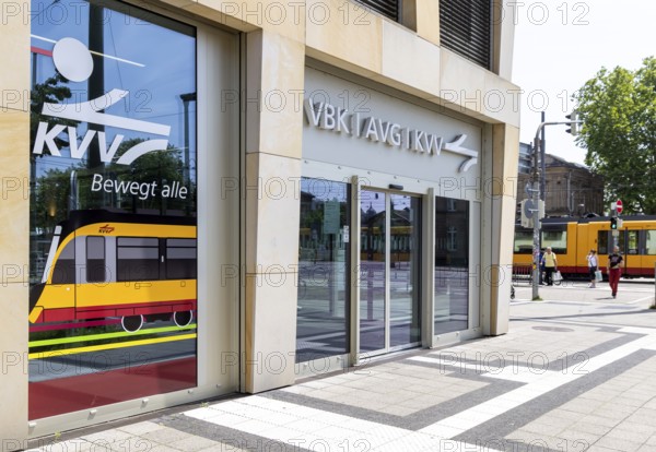 Office of the KVV, Karlsruhe Transport Association. Tram on the move in the city centre. Karlsruhe, Baden-Württemberg, Germany