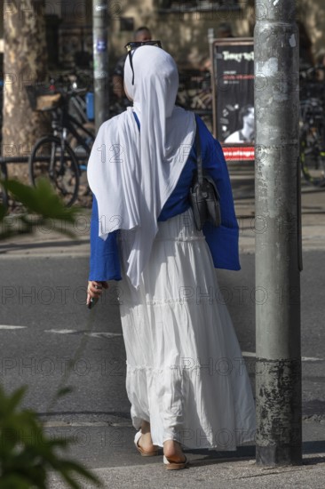Fashionably dressed young Muslim, Bavaria, Germany
