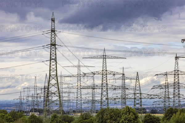 Many high-voltage power lines and lattice towers in the district of Ludwigsburg near Besigheim, Baden-Württemberg, Germany
