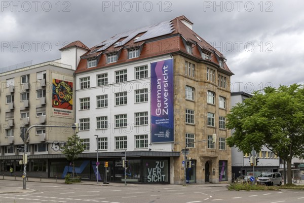 Baden-Württemberg Foundation. Exterior view of the building with logo and claim: German Zuversicht entsteht im Südwesten. Stuttgart, Baden-Württemberg, Germany