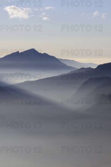 Mountain silhouettes... Alpine peaks and mountain ranges in the Bavarian Alps, light fog rises from the valleys, which creates an idyllic atmosphere in the light of the low sun, romantic view from Oberstdorf towards Kleinwalsertal, local nature, Bavaria, Allgäu, Allgäu Alps, Bavarian, Germany, Western Europe