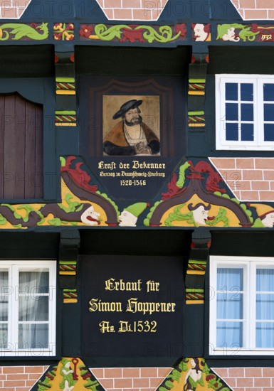 Hoppenerhaus, the most magnificent half-timbered house in the historic centre of Celle with a picture of Duke Ernst the Confessor, detail with painted wood carvings, Celle, Lower Saxony, Germany