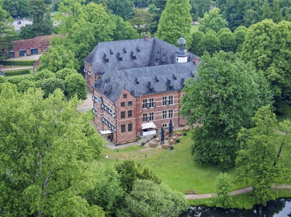 Reinbek Castle, one of the secondary residences of the ducal house of Schleswig-Holstein-Gottorf, was built in the 16th century in the Renaissance style and today serves as the town's art and cultural centre. Aerial view. Reinbek, Schleswig-Holstein, Germany