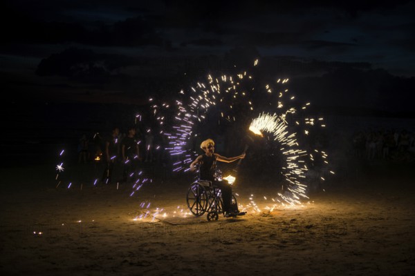 Fire show, jugglers with fire, wheelchair users, Ao Nang Beach, sunset, Ao Nang, Krabi, Thailand