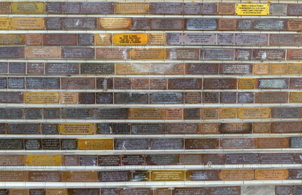 Sponsorship messages on copper plaques at Southwold Pier, Southwold, Suffolk, England, UK