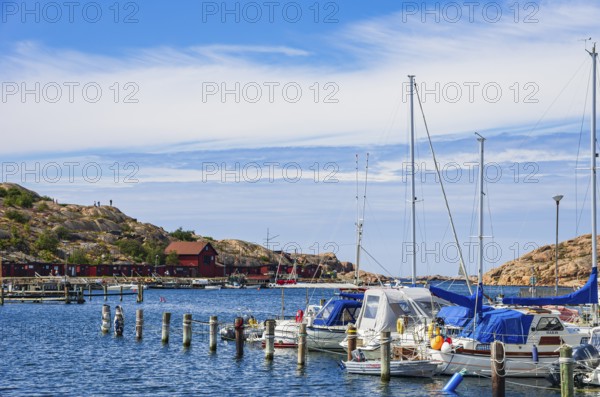 Boats moored at the jetty in the marina in the northern harbour (Norra Hamnen) of Lysekil, Bohuslän, Västra Götalands län, Sweden, Scandinavia, for editorial use only
