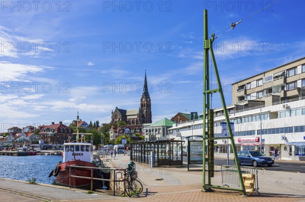 South harbour with house front and church, Lysekil, Bohuslän, Västra Götalands län, Sweden, Scandinavia