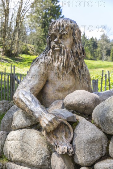 Figure of the river god Danuvius by sculptor Wolfgang Eckert at the source of the Breg, source of the Danube in Furtwangen in the Black Forest, Baden-Württemberg, Germany