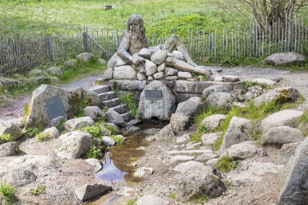 Figure of the river god Danuvius by sculptor Wolfgang Eckert at the source of the Breg, source of the Danube in Furtwangen in the Black Forest, Baden-Württemberg, Germany