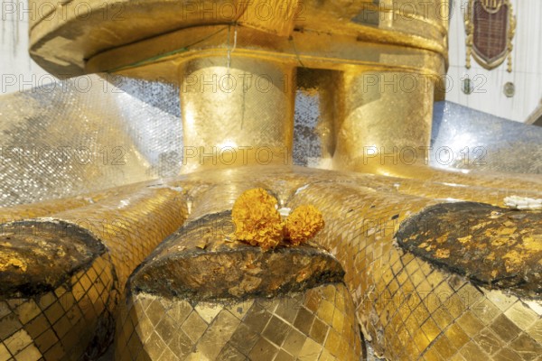 Feet of a 32 metre high standing Buddha decorated with glass mosaics and 24-carat gold, Luang Pho To or Phrasiariyametri, Wat Intharawihan, Bangkok, Thailand