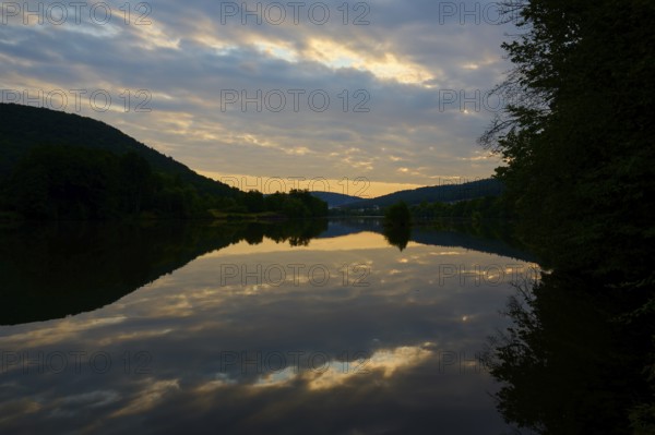 A calm river at dusk with dramatic clouds reflected in the water, summer, Grünenwört, Wertheim, Main, Main-Tauber-Kreis, Baden-Württemberg, Germany