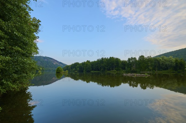 A clear blue sky with scattered clouds reflected on a quiet river, summer, Grünenwört, Wertheim, Main, Main-Tauber-Kreis, Baden-Württemberg, Germany