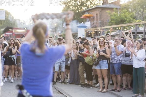 Spectators of the band Berlin Percussion on the RAW grounds as part of the Fête de la Musique. The music event, which originated in France, has been held as a street event on the longest day of the year on 21 June since 1982. The Fête de la Musique has also been held in Berlin since 1995 and is celebrating its 30th anniversary this year. 21.06.2025