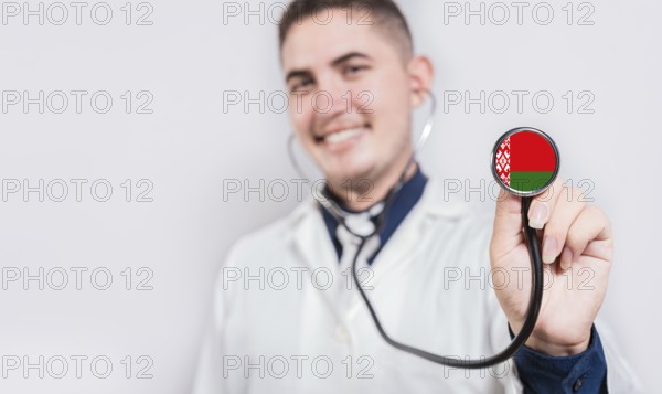 Doctor showing stethoscope with Belarus flag. Belarus national healthcare concept