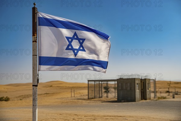 Israeli flag waving in desert wind near military checkpoint under harsh sunlight. Generative ai, AI generated
