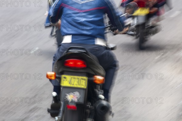Man riding a motorcycle, Riding at high speed, Photo with motion blur, City of Quito, Pichincha province, Ecuador, South America